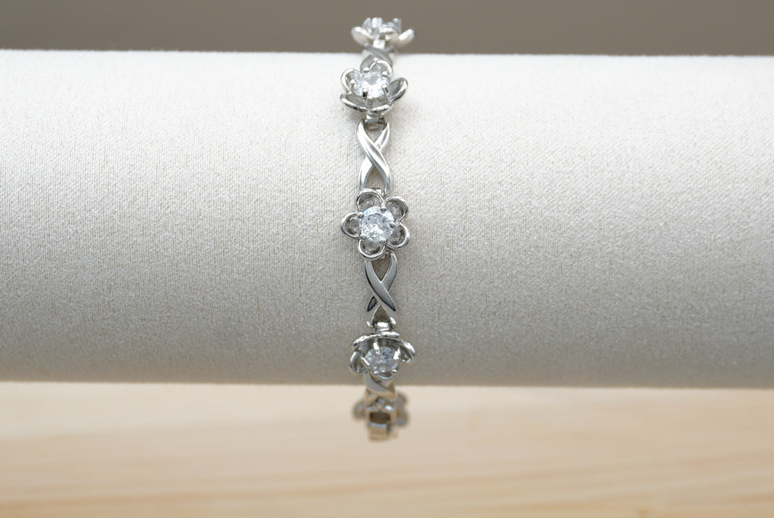 PULSERA FLORES CON ZIRCONIAS  CHAPA DE RODIO